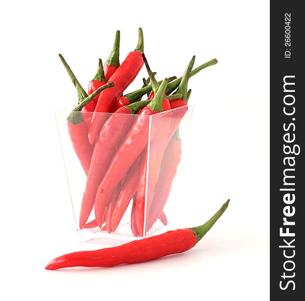 Red chillies on white background