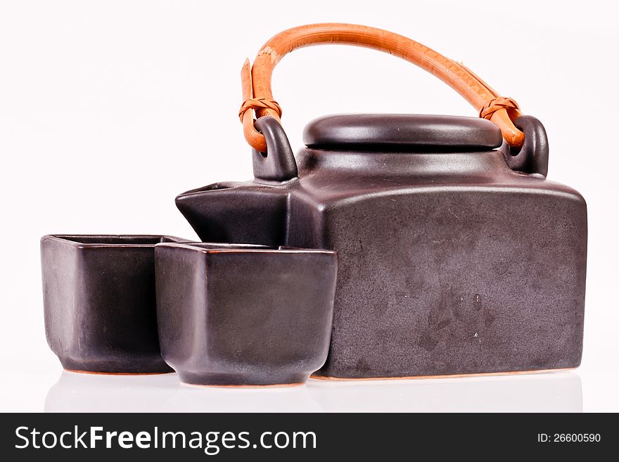 Black ceramic teapot on whitebackground