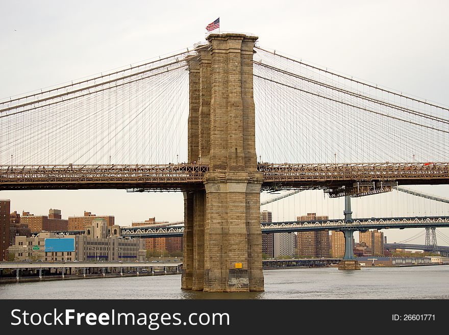 Vertical view of the first tower of the Brooklyn Bridge in Manhattan, New York. Vertical view of the first tower of the Brooklyn Bridge in Manhattan, New York