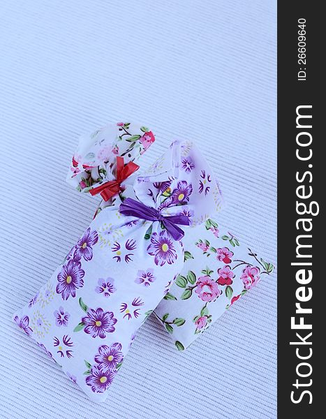 Two flower aroma bags on light background