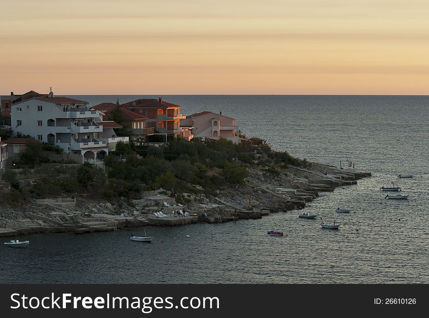 Croatia. Sunset over Adriatic with a view on peninsula with houses. Croatia. Sunset over Adriatic with a view on peninsula with houses