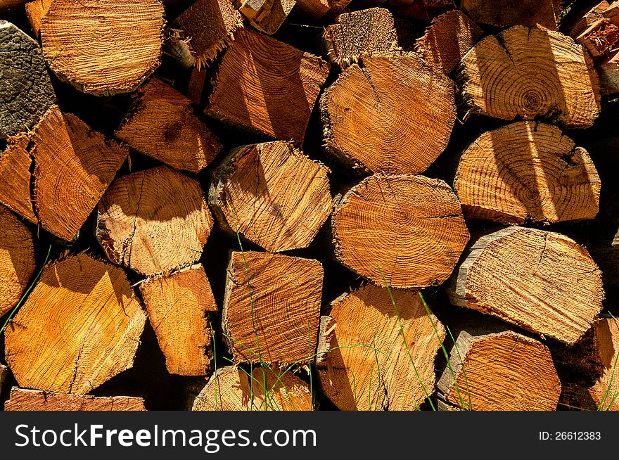 A pile of chopped Firewood background. A pile of chopped Firewood background