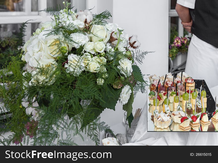 Flowers and tray canapes at a party close up. Flowers and tray canapes at a party close up