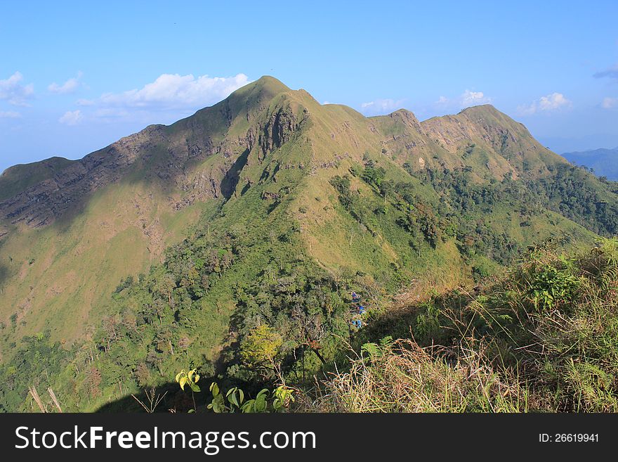 Conquer White elephant Mountain, Which is the highest peak of the Thong Pha Phum National Park, with a height of 1249 meters from sea level, with a sparse forest interspersed with meadow, look at the direction 360 degrees, there is a beautiful ridge,Province Kanchanaburi, in Thailand