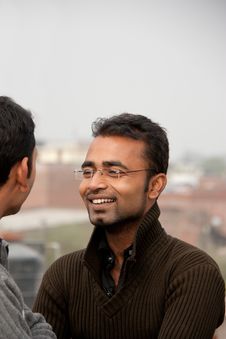 Two Indian Young People On Discussion Stock Photo