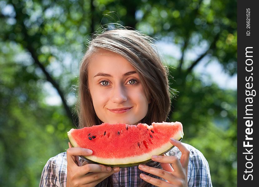 Young woman with watermelon outdoors. Young woman with watermelon outdoors