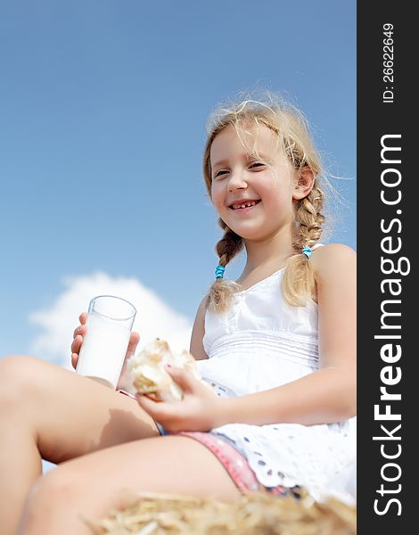 A pretty young girl dines on clean air