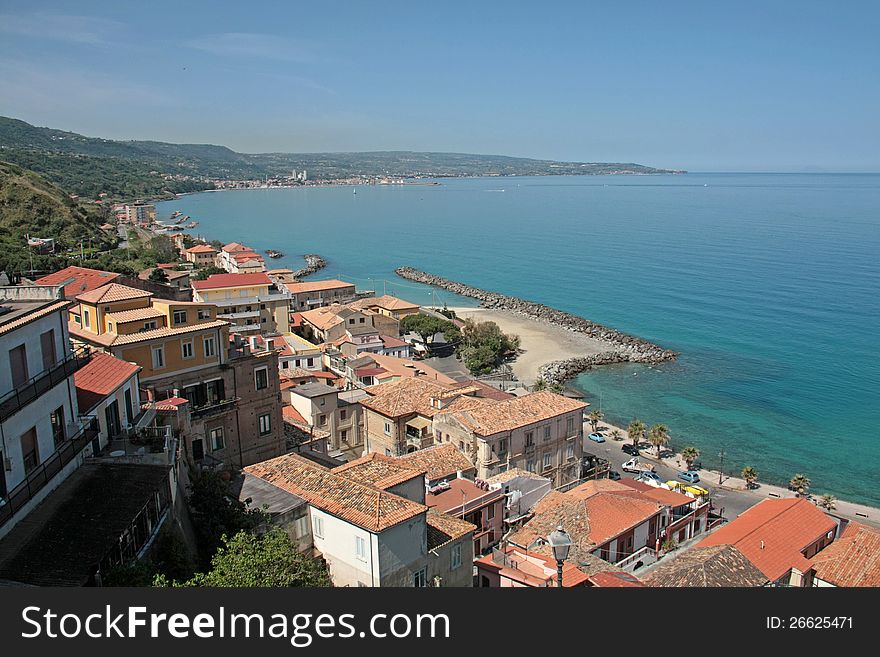 Beautiful blue Tyrrhenian Sea and harbour. Beach with white sand. Idyllic holiday location. Beautiful blue Tyrrhenian Sea and harbour. Beach with white sand. Idyllic holiday location