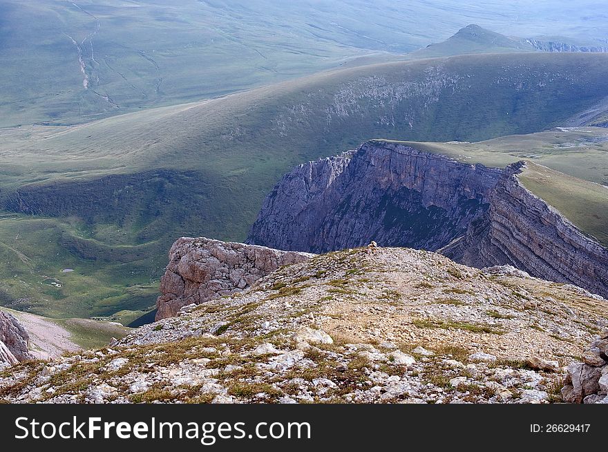 Mountain landscape with rocks and green hills. Caucasus State Biosphere Reserve. Caucasus, Russia