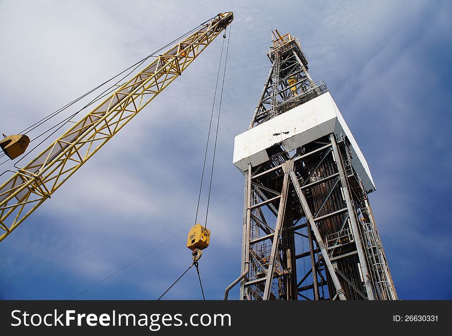 Derick Of Drilling Rig With The Yellow Rig Crane