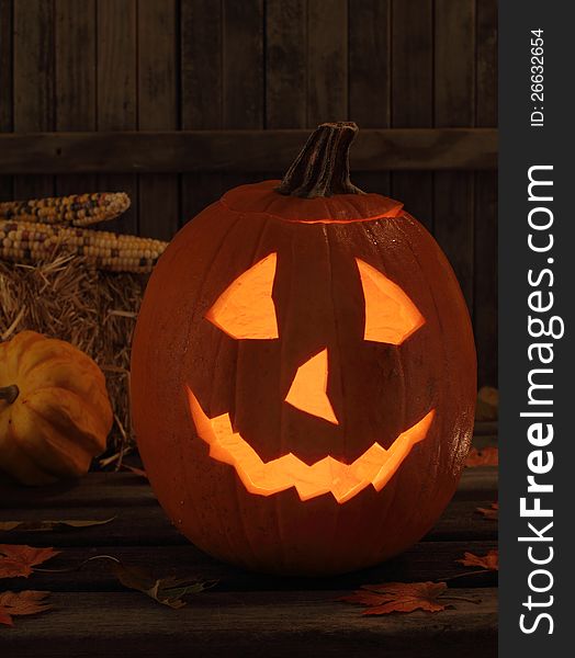 Smiling halloween jack-o-lantern on a wood deck