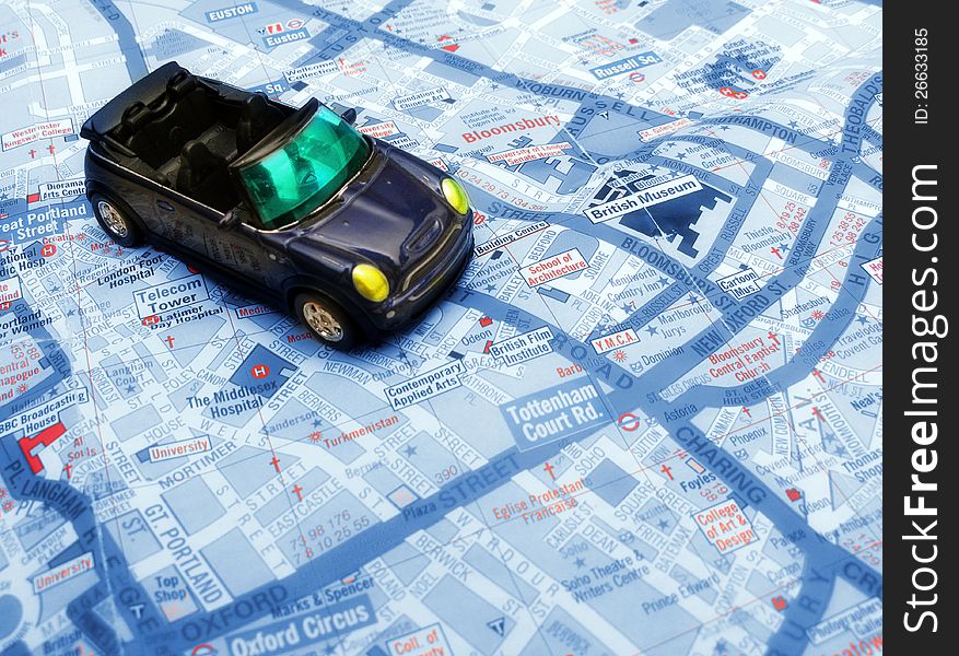 Convertible blue car over London map. Convertible blue car over London map