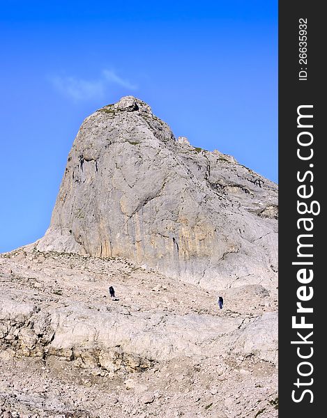 Two climbers in the mountains among the rocks