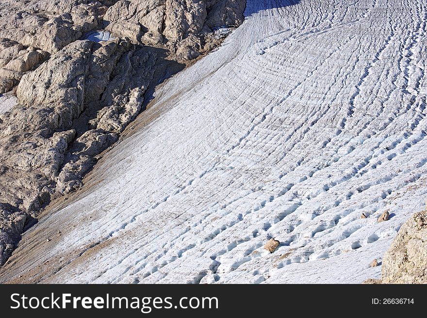 Glacier with cracks on the mountain slope