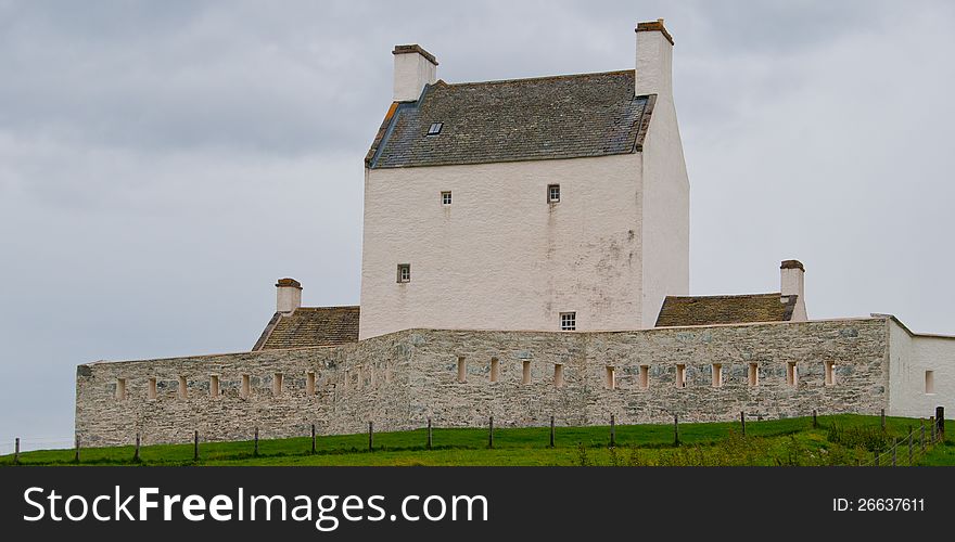 Corgraff Castle, near Tomintoul, Moray Scotland, Uk. This Castle on the A939. Corgarff Castle is located slightly west of the village of Corgarff, in Aberdeenshire, north-east Scotland. It stands by the Lecht road, which crosses the pass between Strathdon and Tomintoul The castle was built around 1530 by the Elphinstone family and leased to the Forbes of Towie.[ In 1571 it was burned by their enemy, Adam Gordon of Auchindoun, resulting in the deaths of Margaret Campbell, Lady Forbes, her children, and numerous others, 26 in total, and giving rise to the ballad Edom o Gordon. In May 1607 the castle was captured from Alexander, 4th Lord Elphinstone by Alexander Forbes of Towie and his companions including a piper called George McRobie. They used hammers and battering rams to break down the gate, then fortified the house with a garrison of &#x22;Highland thieves and limmers&#x22;. In 1626 it was acquired by the Earl of Mar. In 1645 it was used as an assembly point by the troops of the Marquis of Montrose. It was burnt again in both 1689 and 1716 by Jacobite supporters. It was resettled by the Forbes family in 1745 but had to be forfeited due to their Jacobite leanings. In 1748 it was bought by the British government and rebuilt and extended as a barracks. A detachment of government troops was stationed there, on the military road from Braemar Castle to Fort George, Inverness. Military use continued as late as 1831, after which the tower was used to suppress