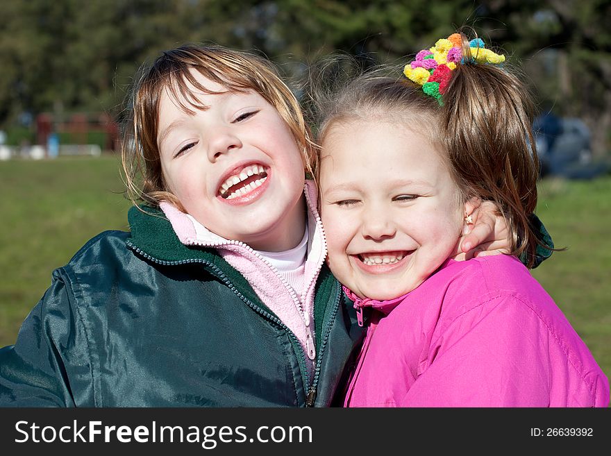 Portrait of two laughing little girls. Portrait of two laughing little girls