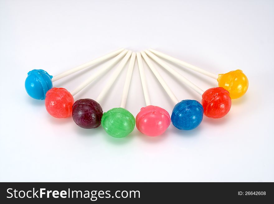 Colorful array of lollipops on white. Colorful array of lollipops on white
