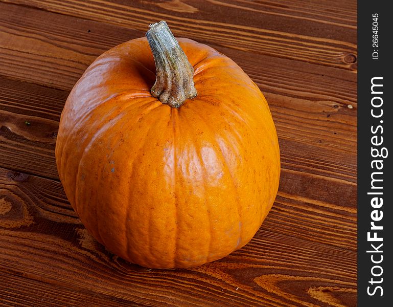 Perfect Pumpkin isolated on Wooden background