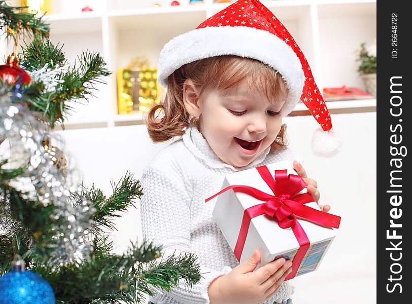 Beautiful girl dressed in a Santa Claus hat