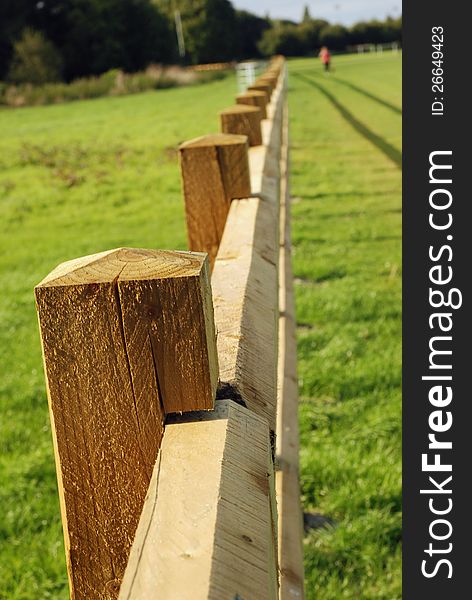 Newly erected fence round playing field. Newly erected fence round playing field.