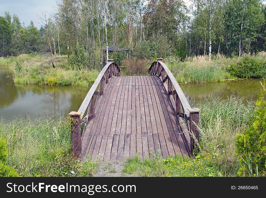 This is a shot of an  wooden footbridge. This is a shot of an  wooden footbridge