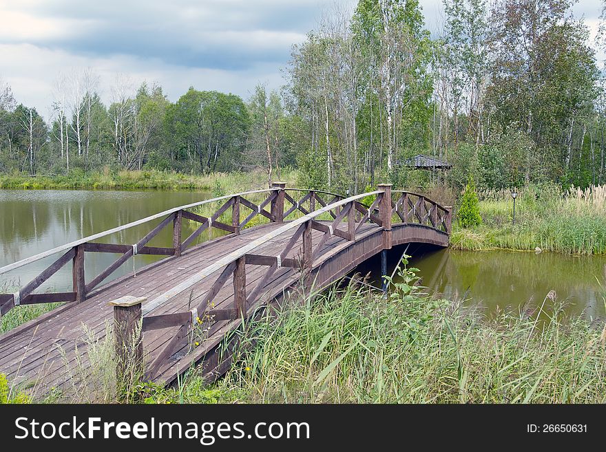 This is a shot of an  wooden footbridge. This is a shot of an  wooden footbridge