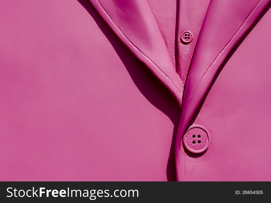 Detail of a plastic rose jacket with a rose button. Detail of a plastic rose jacket with a rose button