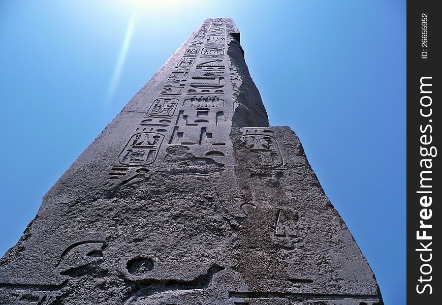 View of an obelisk reflecting the sun, found in the Temple of Karnak in Luxor, Egypt. View of an obelisk reflecting the sun, found in the Temple of Karnak in Luxor, Egypt