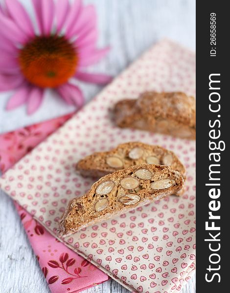 Three biscotti with pink flower