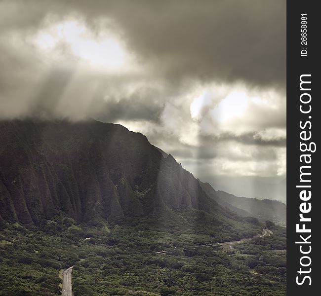 Hawaii, pali lookout with rays of light breaking through the clouds