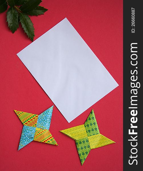 Blank envelope with two paper stars on red. Blank envelope with two paper stars on red.