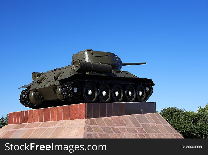 Legendary old soviet military tank T-34 against blue sky. Legendary old soviet military tank T-34 against blue sky