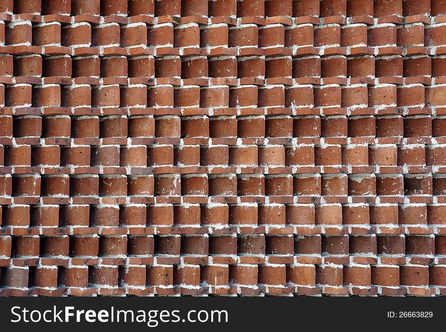 The photo of red brick wall.