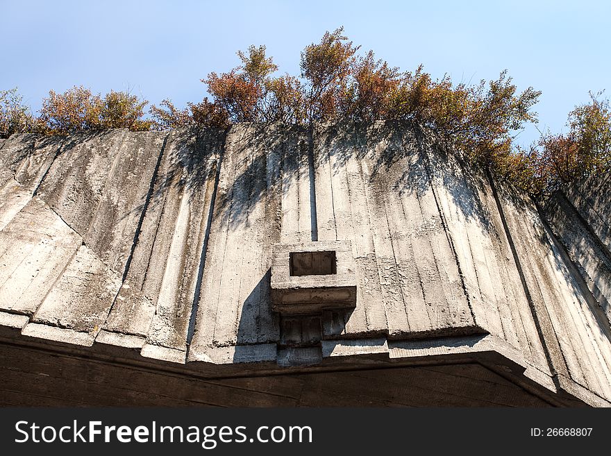 Abstract geometric concrete background illuminated by sun