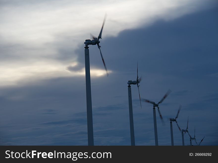 Silhouette wind mill at sun set time. Silhouette wind mill at sun set time