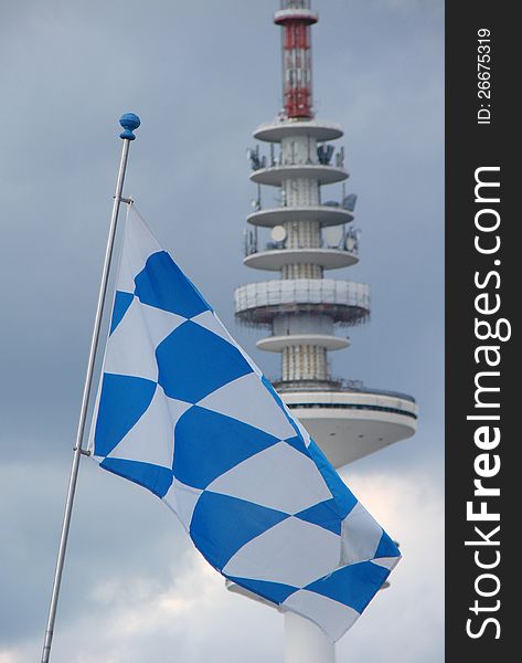 White-blue-checkered-flag bayern as symbol of october fixed and globalization of media communications by means of television transmission. White-blue-checkered-flag bayern as symbol of october fixed and globalization of media communications by means of television transmission