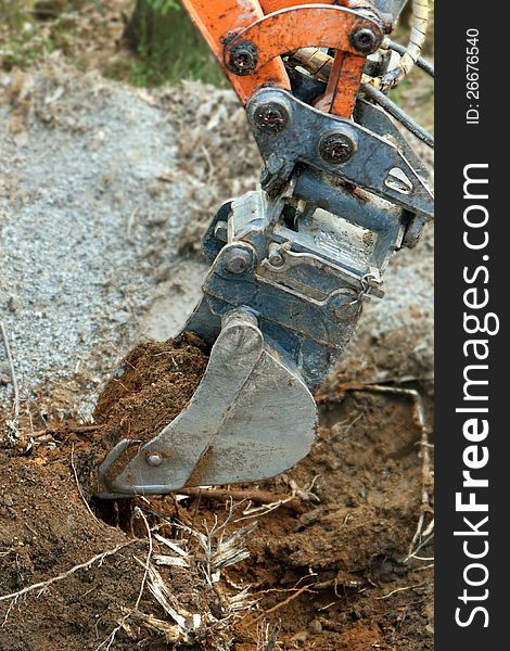 Excavator Digging Ground