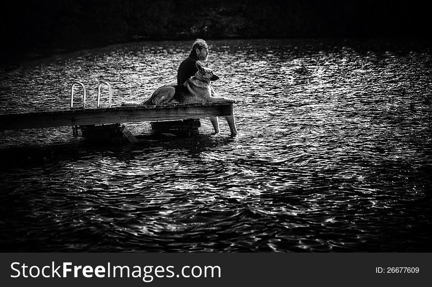 Man on Dock with Dog