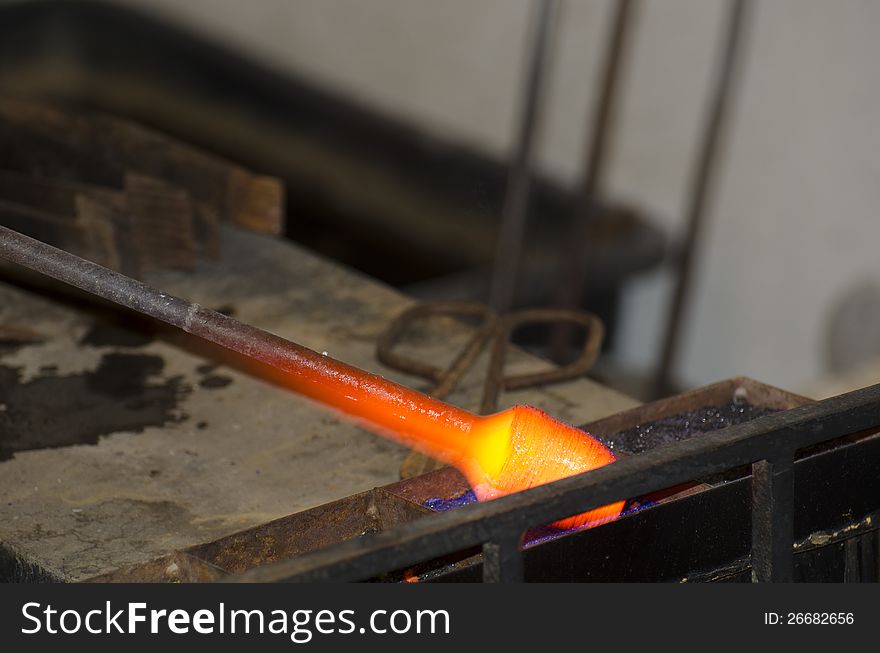 A glass drop in a small glass manufacture in old Prague, Czech Republic