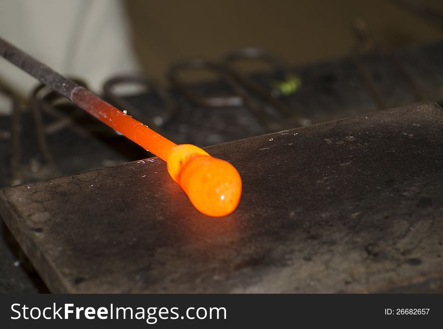 A glass drop in a small glass manufacture in old Prague, Czech Republic