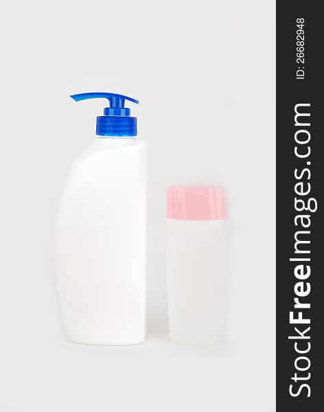 Two Bottles of shampoo on a white background