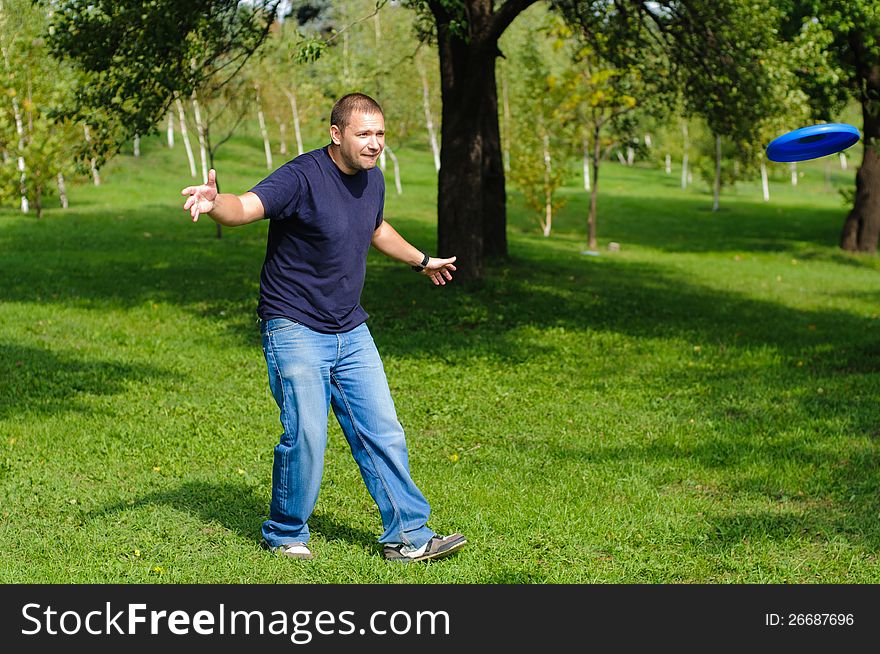 Young Man Playing Frisbee