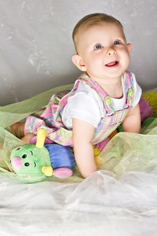 Crawling Baby Girl And Her Toy Stock Images Crawling Baby Girl And Her Toy Stock Images