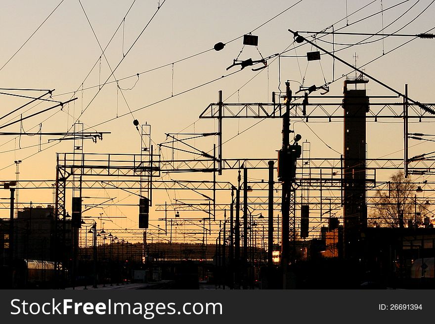 Silhouette of railroad wires at a train station. Silhouette of railroad wires at a train station.