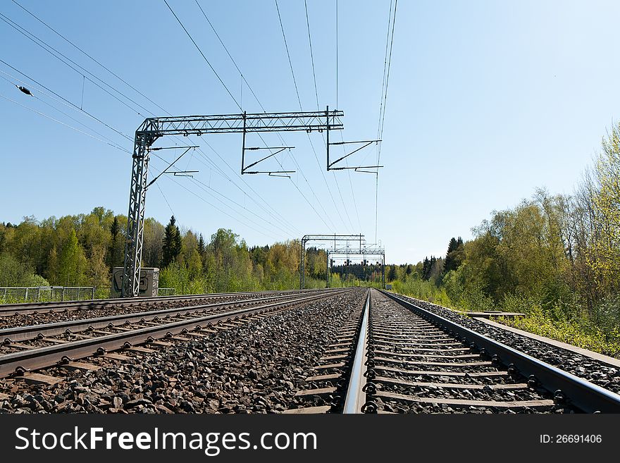 Railway tracks and blue sky in Finland.