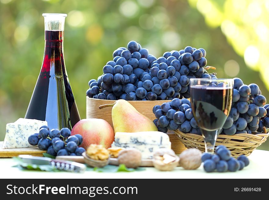 Red wine and red grapes