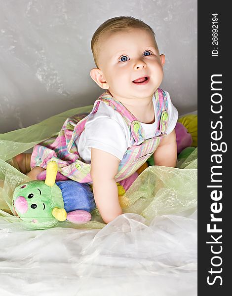 Crawling baby girl and her toy