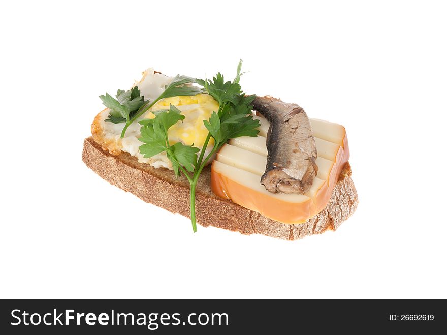 Rye-bread with canned fish, cheese, egg and parsley. Isolated on a white background. Rye-bread with canned fish, cheese, egg and parsley. Isolated on a white background.