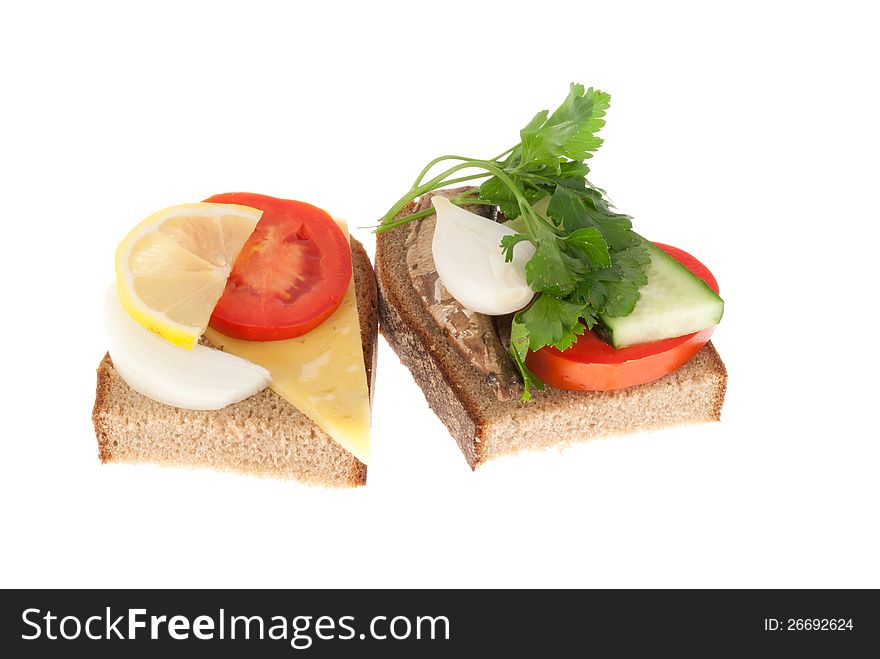 Two bits rye-bread with canned fish and cheese. Isolated on a white background.