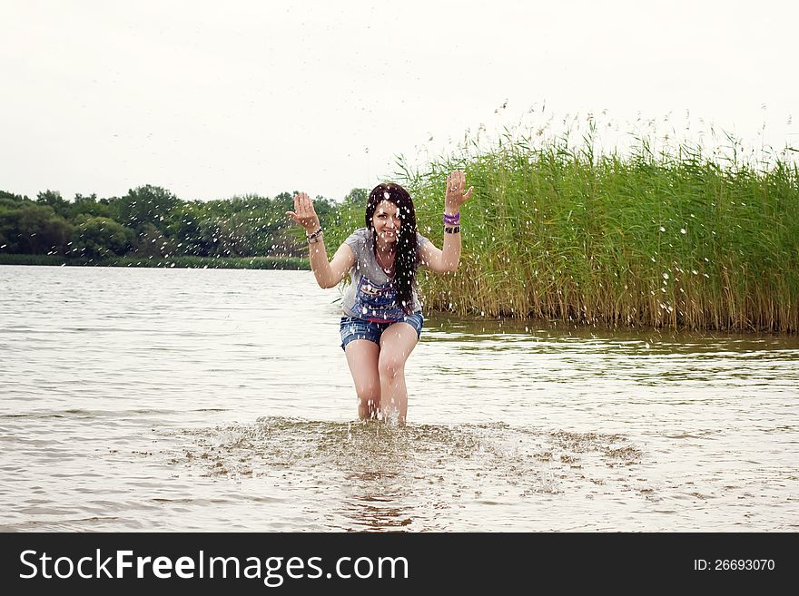 Beautiful woman having a fun in the lake. Beautiful woman having a fun in the lake